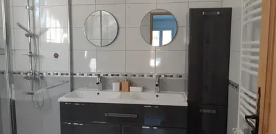 a bathroom with a sink and two mirrors at Maison d'Hôtes & Spa La Chêneraie-Provence Ventoux in Saint-Didier