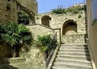 a set of stairs leading up to a stone building at A l’ombre du géant de Provence in Mormoiron