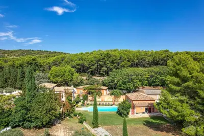an aerial view of a home with a pool and trees at La Petite Maison - Mas des Sous Bois in Ventabren