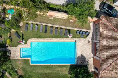 an overhead view of a swimming pool in a yard at Le Pool House - Private Jacuzzi - Mas des Sous Bois in Ventabren