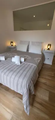 a bedroom with a large bed with two lamps at Villa la Provence, Luxe, Confort et Joie de Vivre in Carpentras