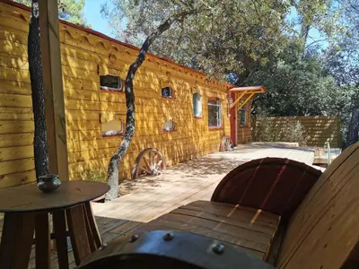 a patio with a table and chairs and a building at Interlude in Lambesc