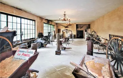 a room filled with lots of antique furniture and windows at 2 Bedroom Amazing Home In Apt in Apt