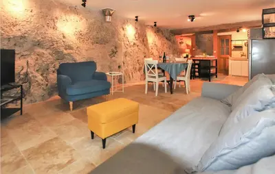 a living room with a couch and chairs and a table at 2 Bedroom Amazing Home In Apt in Apt