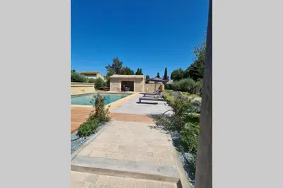 a view of a swimming pool with a house at Le Cabanon de Nans. Gîte de charme en Provence. in Grans