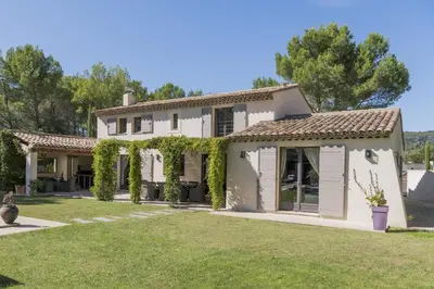 an exterior view of a house with a yard at high standard provencal bastide with heated pool in lourmarin in the luberon, vaucluse. 10 people in Lourmarin
