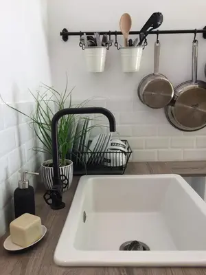 a kitchen counter with a sink and pots and pans at Chambre d'hôte Mas de Silvacane in La Roque-dʼAnthéron