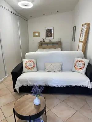 a bedroom with a bed with blue towels on it at Studio les petits lutins in Entraigues-sur-la-Sorgue