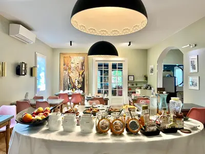 a table with food on it in a room at Logis Hôtel restaurant des Pins in Bédoin