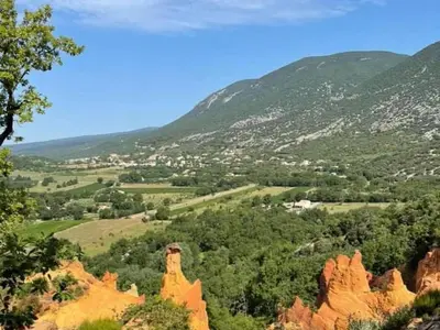 a view of a valley with trees and mountains at Villa Abayers in Apt