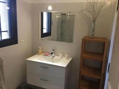 a bathroom with a sink and a mirror at Petit cocon dans le Luberon in Lauris