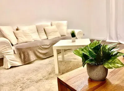 a living room with a couch and a table at *FONTAINE MOUSSUE*HYPER CENTRE*T2 STANDING* in Salon-de-Provence