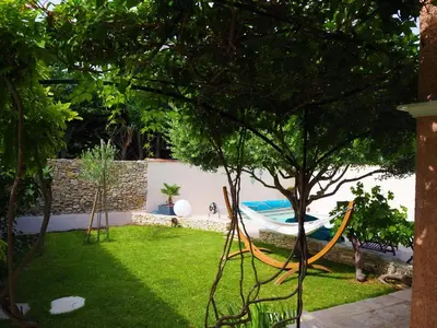 a garden with a hammock in a yard at Holiday Home in Pertuis with Private Pool in Pertuis