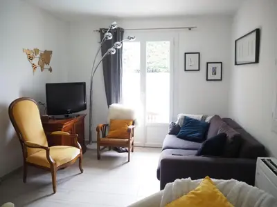 a living room with a couch and a tv at Holiday Home in Pertuis with Private Pool in Pertuis