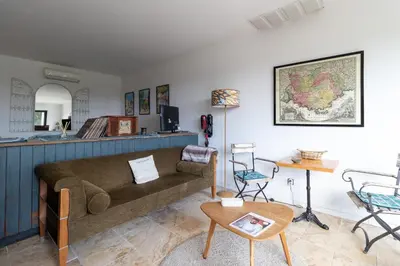 a living room with a couch and a table at Terre Luberon in Pertuis