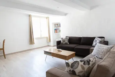 a living room with a couch and a coffee table at Entre blé et lavande in Bonnieux
