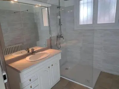 a bathroom with a sink and a glass shower at Maison avec piscine privée à Caromb, idéale pour famille in Caromb