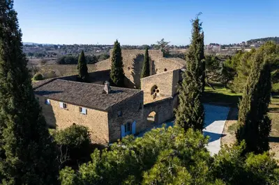 an aerial view of a villa with trees at Château Saint-Pierre de Mejans in Puyvert