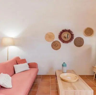 a living room with a couch and a table at Domaine Plan des Devens in Roussillon