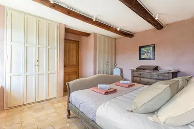 a bedroom with a bed with two towels on it at Pavillon Lou in Crillon-le-Brave