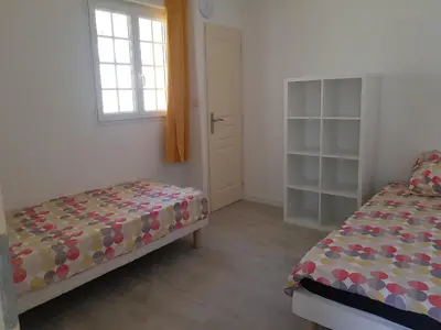 a bedroom with a bed and a window at Domaines des confines in Monteux