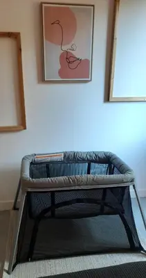 a bench in a room with a picture on the wall at Gîte des Bartavelles in Saint-Didier