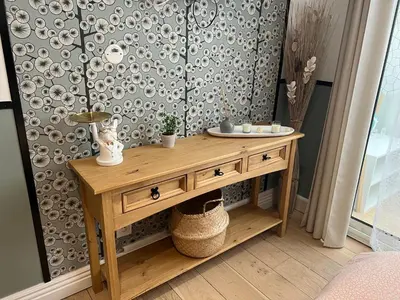 a wooden table in a room with a wall at Lou Pitchoun in Aix-en-Provence