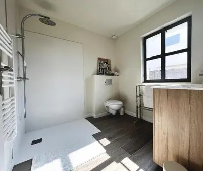 a bathroom with a toilet and a sink and a window at La Chambre Cézanne in Aix-en-Provence