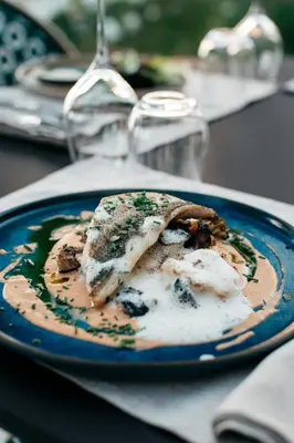 a blue plate of food on a table at Domaine Perréal Chambres d'hôtes in Gargas