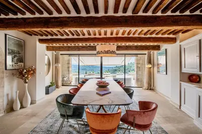 a dining room with a table and chairs at Le Mas Victoria in Gordes