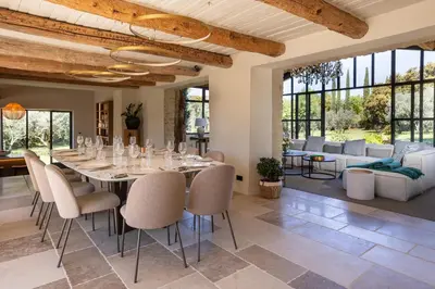 a dining room with a table and chairs at Le Mas Luca in Gordes