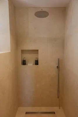 a bathroom with a shower stall with a shower at La Bastide Neuve in Joucas
