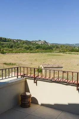 a balcony with a view of a field at La Bastide Neuve in Joucas