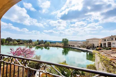 a view of a river from a balcony at Village Pont Royal en Provence - maeva Home - Appartement 2 Pièces 5 Personnes - Sélection - super Home MAE-1242 in Mallemort