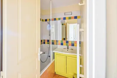 a bathroom with a yellow sink and a shower at Village Pont Royal en Provence - maeva Home - Appartement 2 pièces 6 personnes Sélection MAE-7984 in Mallemort