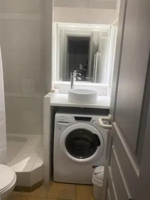 a bathroom with a washing machine and a sink at Village Pont Royal en Provence - maeva Home - Appartement 2 pièces 6 personnes climatisé - Prestige MAE-4537 in Mallemort