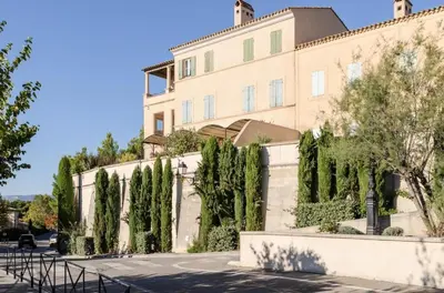 a building with trees in front of it at Village Pont Royal en Provence - maeva Home - Appartement climatisé avec terrasse 4 pièces 8 personnes - Prestige - super Home MAE-6210 in Mallemort
