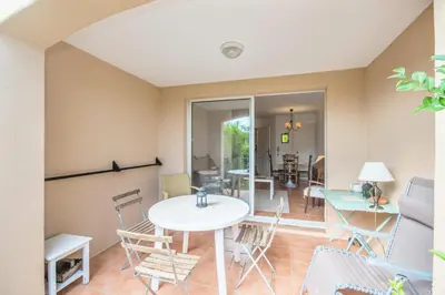 a living room with a table and chairs at Village Pont Royal en Provence - maeva Home - Studio climatisé 4 Personnes - Sélection MAE-7498 in Mallemort