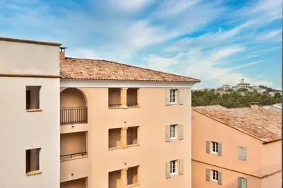 an apartment building with a view of the city at Les Coteaux de Pont Royal en Provence - maeva Home - Appartement 3 Pièces 6 Personnes - Sélection MAE-5989 in Mallemort