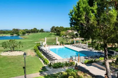 an image of a swimming pool at a resort at Résidence Hôtel du Golf de Pont Royal - maeva Home - Appartement climatisé ravissant 2 pièces 4 personnes - Prestige - super Home MAE-3104 in Mallemort