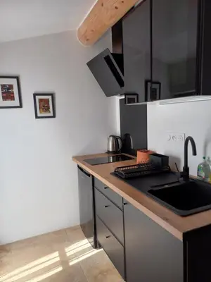a kitchen with a sink and a counter top at Le Mas Joséphine in Saint-Rémy-de-Provence
