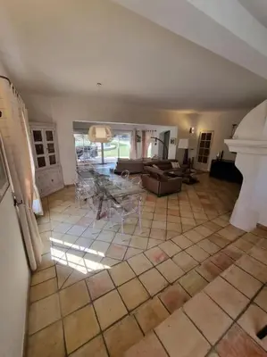 a living room with a couch and a table at Maison de Charme au Pays de Cézanne in Aix-en-Provence