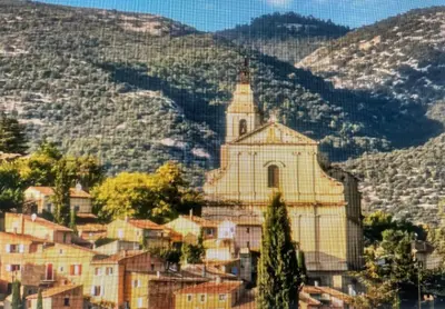 a village with a church in the mountains at campdebaseventoux, vue sur le ventoux insolite in Bédoin