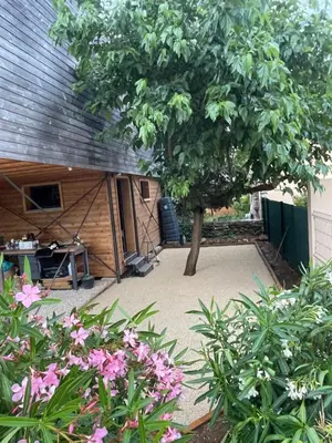 a backyard with a tree and a shed at campdebaseventoux, vue sur le ventoux insolite in Bédoin