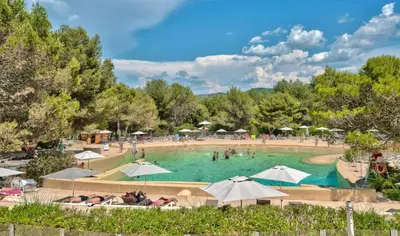 a large swimming pool with umbrellas and people in it at Les Maisons de Pont Royal en Provence - maeva Home - Maison 3 pièces 6 personnes climatisé - Sélection MAE-6421 in Mallemort
