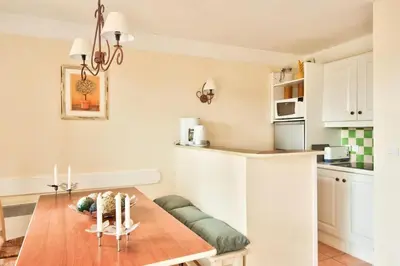 a kitchen with a table and a dining room at Les Maisons de Pont Royal en Provence - maeva Home - Maison 3 pièces 6 personnes climatisé - Sélection MAE-6421 in Mallemort