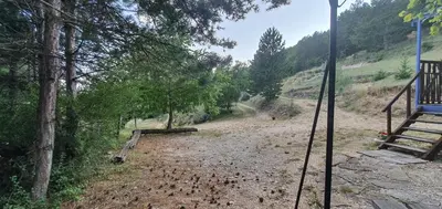 a dirt road with trees on the side of a hill at Aurel inattendu in Aurel