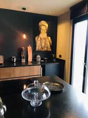 a kitchen with a table with a bowl on it at La Suite TAMAN au centre de Salon in Salon-de-Provence