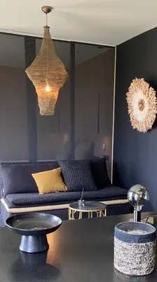 a living room with a couch and a table at La Suite TAMAN au centre de Salon in Salon-de-Provence