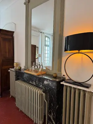 a bathroom with two radiators and a mirror at La Chapelle sur la Sorgue in LʼIsle-sur-la-Sorgue